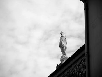 Low angle view of statue against cloudy sky