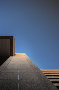 Low angle view of building against clear blue sky