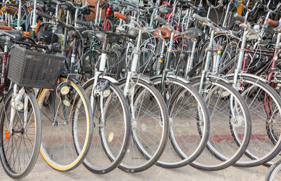 Row of bicycle parked in parking lot