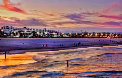 Scenic view of beach against sky during sunset