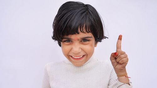 Close-up of woman with face against white background