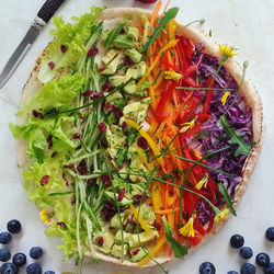 High angle view of chopped vegetables in plate on table