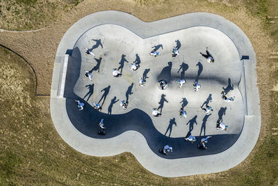 Young woman skateboarding at pump track