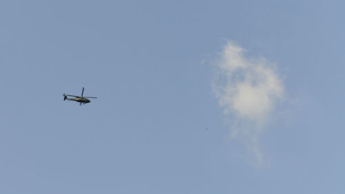 Low angle view of airplane flying in sky