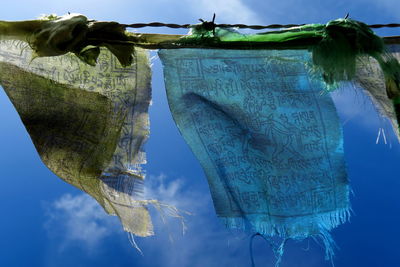 Low angle view of prayer flags against sky