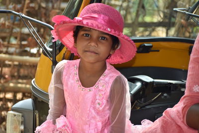 Portrait of cute girl in car