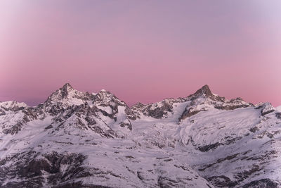 View of snow against sky during sunset