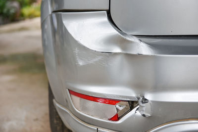 Close-up of dents on car