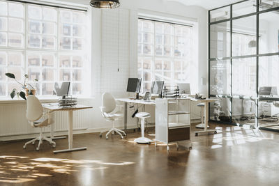 Empty modern workspace with computers arranged on table