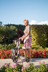 Full length of woman with mobility walker