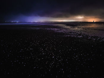 Scenic view of sea against sky at night