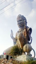 Low angle view of statue against sky