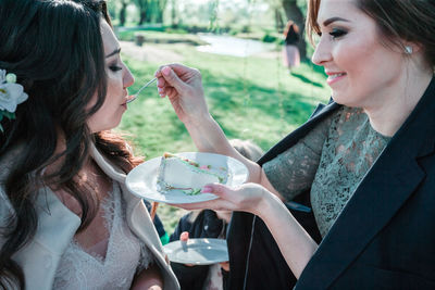 Young woman holding ice cream