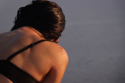 Close-up of woman in bikini at beach