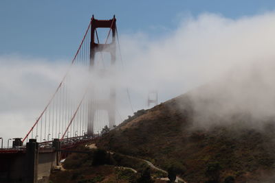 View of suspension bridge in foggy weather