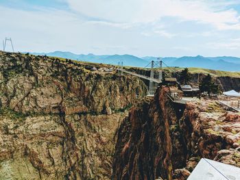 Scenic view of mountain against cloudy sky