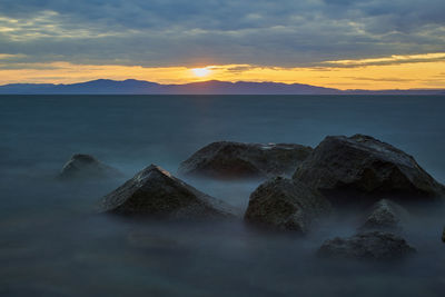 Scenic view of sea against sky during sunset