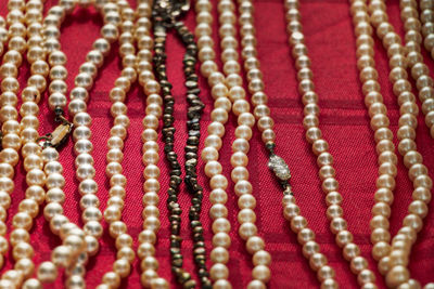 Full frame shot of necklaces on table