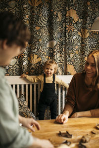 Family with son making cookies at home