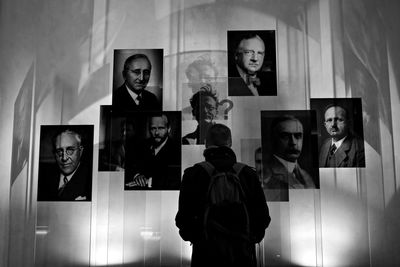 Reflection of man and woman in museum