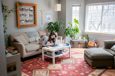 Young woman working from home during covid 19