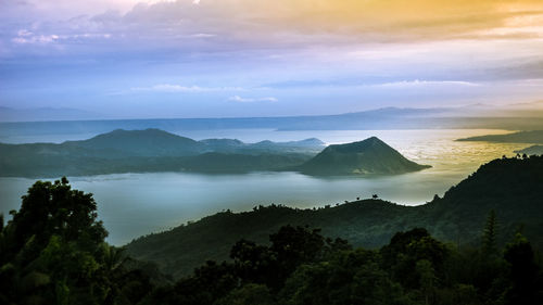 Scenic view of landscape against cloudy sky