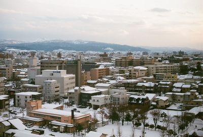 High angle view of cityscape against sky during winter