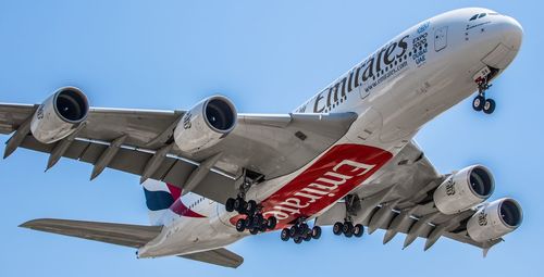 Low angle view of airplane flying in sky