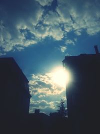 Low angle view of building against sky at sunset