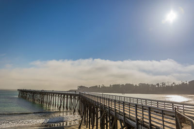 Pier over sea against sky