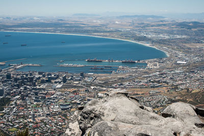 High angle view of sea and buildings against sky