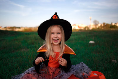 Portrait of cute smiling girl on field