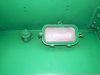 High angle view of blue water on green wall