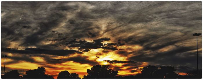 Low angle view of cloudy sky at sunset