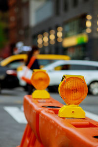 Close-up of yellow car on street