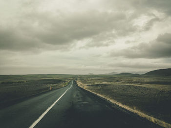 Road amidst landscape against sky