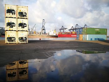 View of commercial dock against cloudy sky