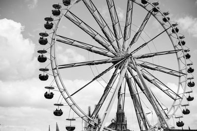 Low angle view of ferris wheel against sky