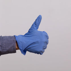 Midsection of man against blue sky over white background