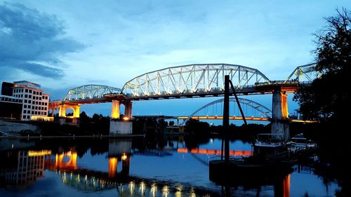 Illuminated john seigenthaler pedestrian bridge over cumberland river at dusk