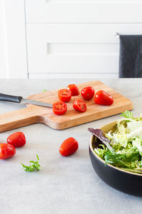 Fruits and vegetables on cutting board at home