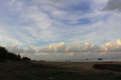 Scenic view of beach against sky during sunset