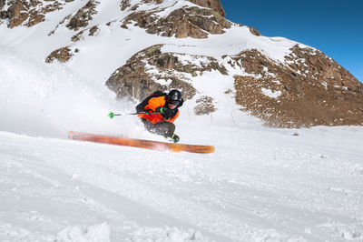 People skiing on snowcapped mountain