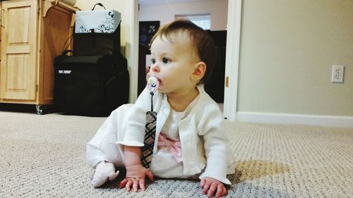 Cute boy sitting at home