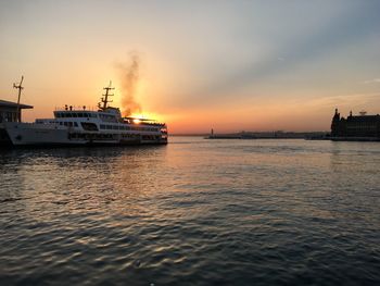 Cruise ship against sky at sunset