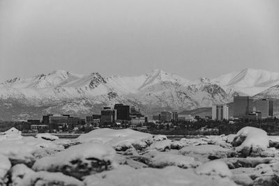 Snow falling on a house in alaska, cold conditions and natural atmosphere.