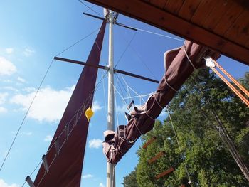 Low angle view of swing against sky