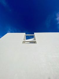 Low angle view of building against blue sky