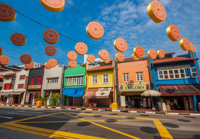 Low angle view of street against buildings in city