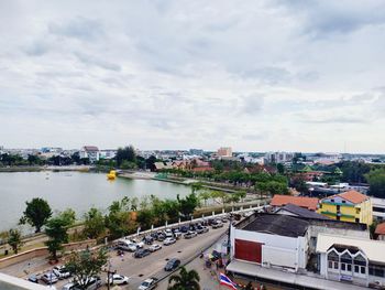 High angle view of road by buildings against sky